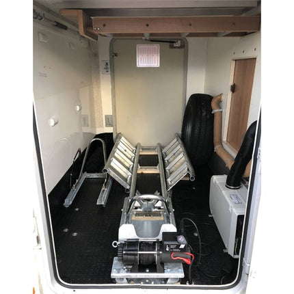 Interior of a vehicle with a winch and equipment setup