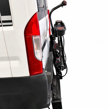 Car hitch receiver attached to a white vehicle with Letang Auto Parts logo.