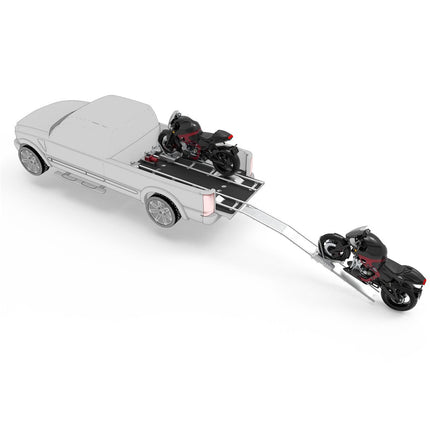 Model of a car with a trailer carrying motorcycles 